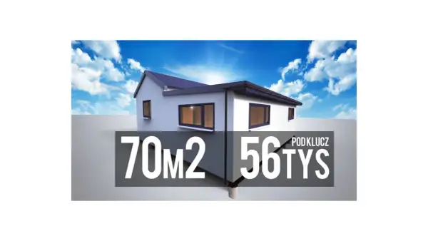 Tani dom pod klucz 70m2 za 56 tys. zł. Biały, nowoczesny budynek z ciemnym dachem i oknami, na tle błękitnego nieba z chmurami.